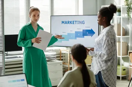 A beautiful business lady giving presentation to her clients